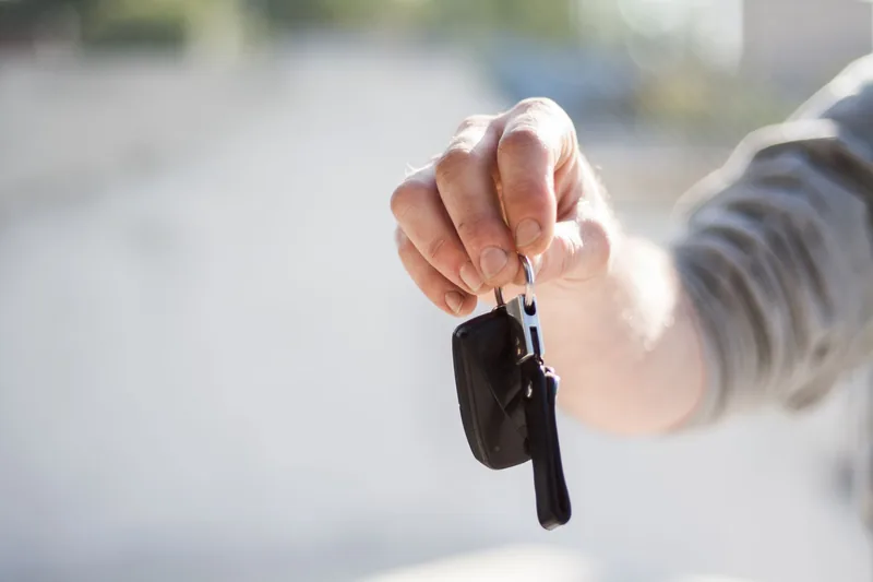 A car being handed over for free doorstep pickup
