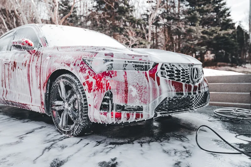 A car covered in foam during an exterior wash